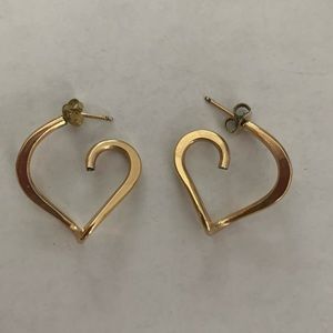 Gold hoop earrings in a unique subtle heart shape.
